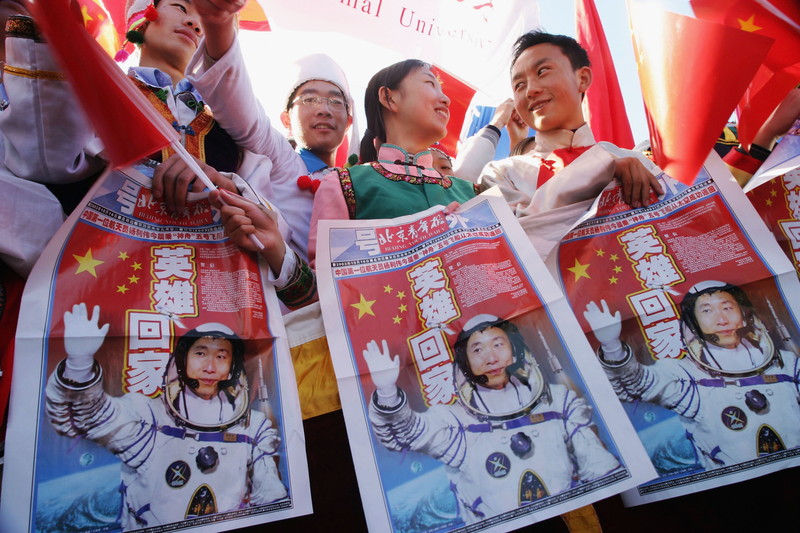 Chinese students celebrating China’s first taikonaut, Yang Liwei.
